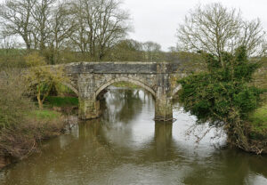 Historic 15th century New Bridge, crossing River Tamar