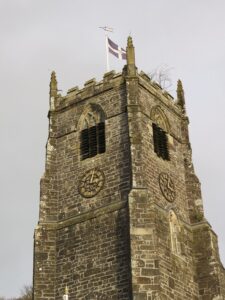 St Neots Church 14thc tower - St Pirans Flag & Oak Apple Day branch